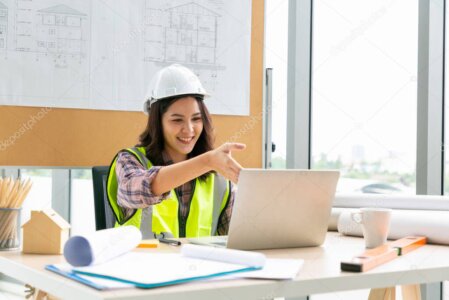 Construction supervisor showing the building site to a remote client via video call